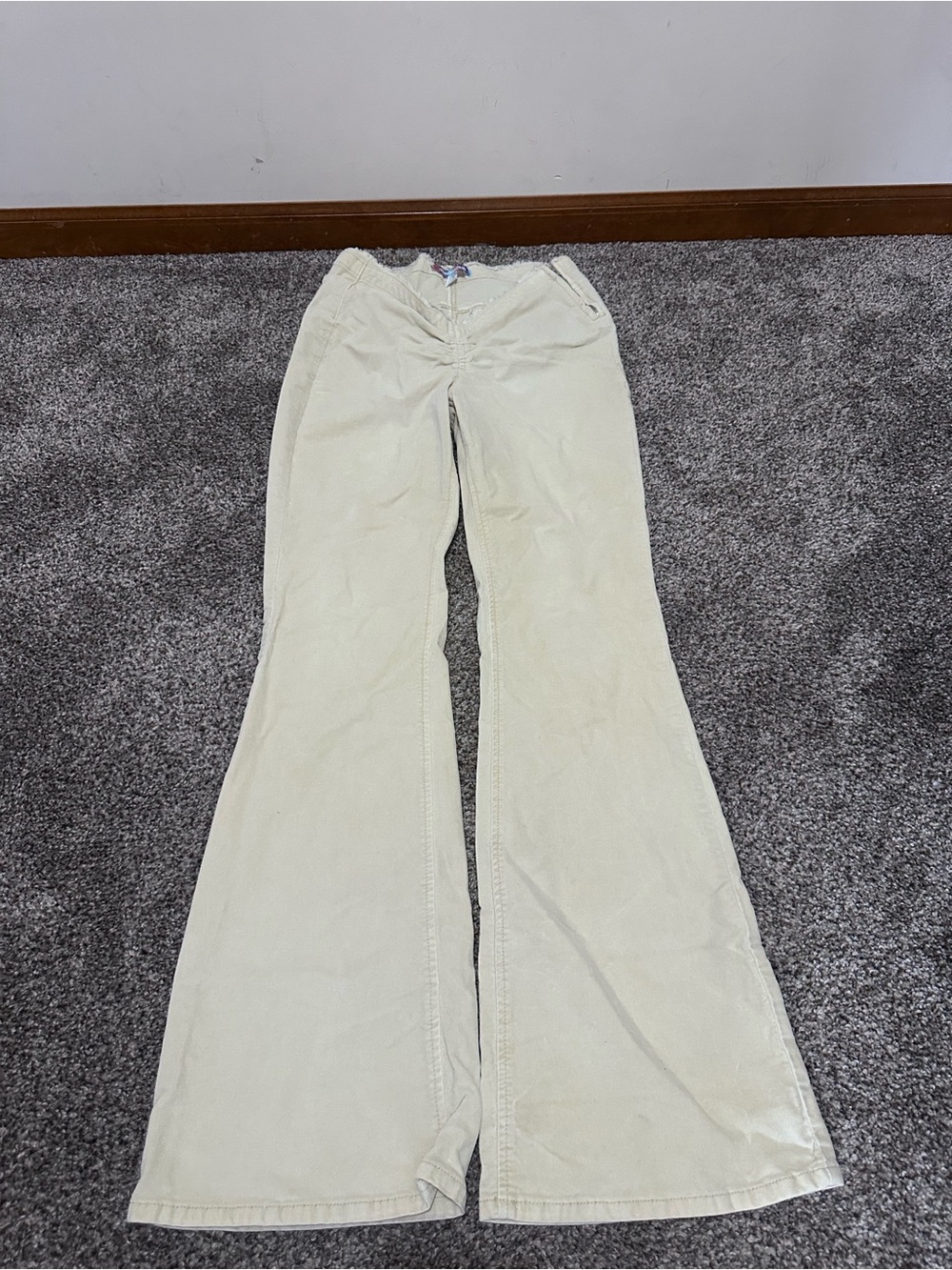 Urban’s Outfitters flared cream jeans.